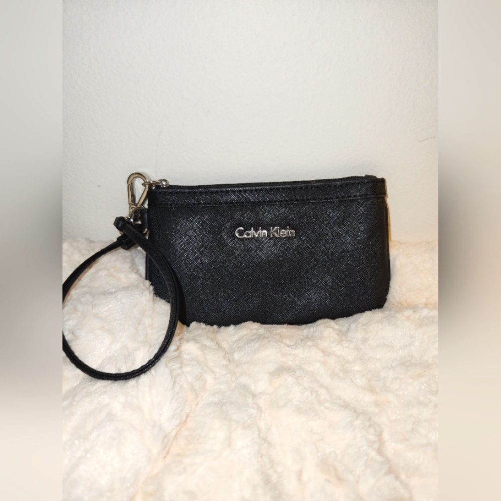 Calvin Klein black wristlet  with silver hardware in EUC